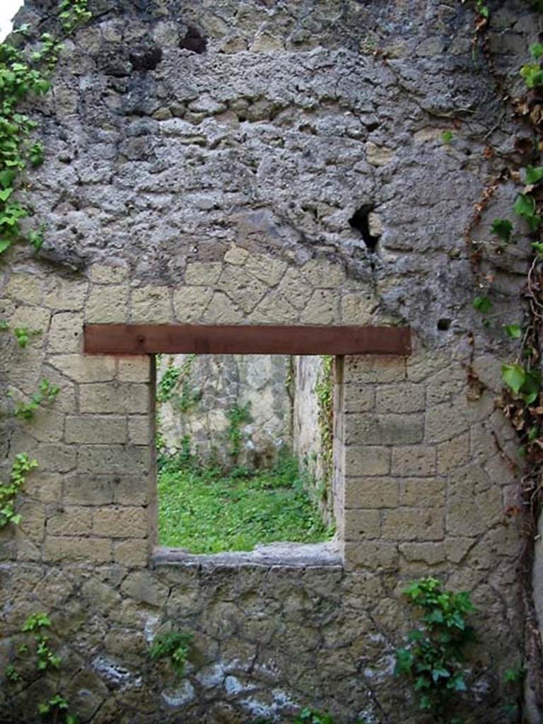 V.15, Herculaneum. May 2003. Looking towards east wall with window into large oecus from the storeroom/cella penaria. Photo courtesy of Nicolas Monteix.